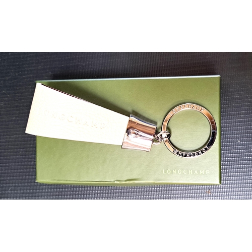 283 - LONGCHAMP KEY RING
Stamped Longchamp on ring and pink leather in Longchamp box, 14cm long