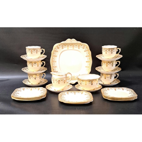 213 - ROSLYN CHINA TEA SERVICE
with gilt decoration on a cream ground, comprising six cups, eight saucers ... 