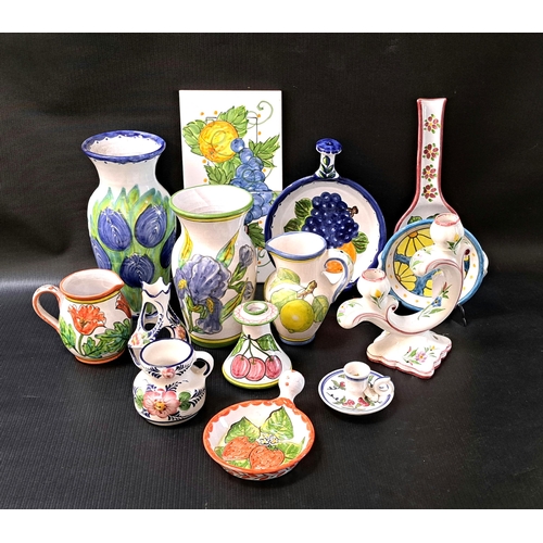 217 - LARGE SELECTION OF COLOURFUL PORTUGUESE CERAMICS
all decorated with flowers and fruit, including vas... 