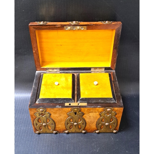 240 - VICTORIAN WALNUT TEA CADDY
with decorative brass banding, the domed lid opening to reveal two lidded... 