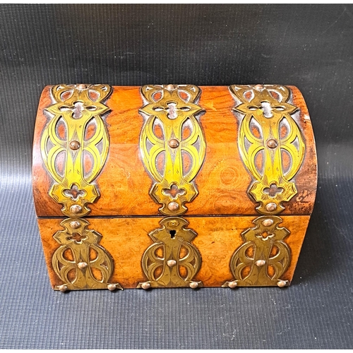 240 - VICTORIAN WALNUT TEA CADDY
with decorative brass banding, the domed lid opening to reveal two lidded... 