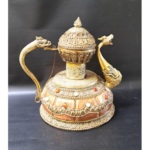 253 - TIBETAN CEREMONIAL DRAGON TEAPOT
in copper and brass, with a monumental dragon handle and spout, wit... 