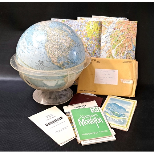 299 - LARGE SELECTION OF VINTAGE NATIONAL GEOGRAPHIC WORLD MAPS
with a National Geographic globe; together... 