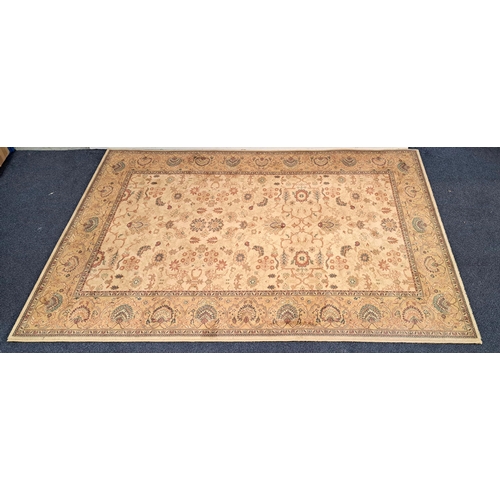 450 - ZIEGLER STYLE RUG
with a mustard ground with floral motifs, 246cm x 173cm