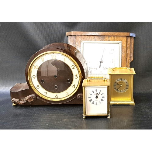 313 - THREE CLOCKS AND A BAROMETER
the clocks comprising two brass cased carriage clocks and a bakelite ca... 