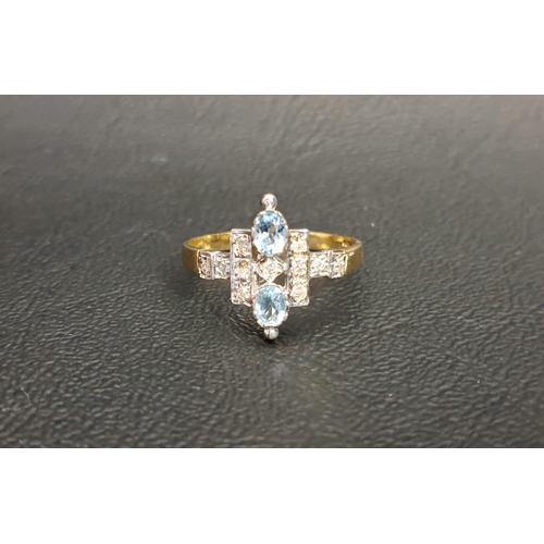 64 - UNUSUAL BLUE TOPAZ AND DIAMOND RING
the two oval cut blue topaz gemstones approximately 0.15cts each... 