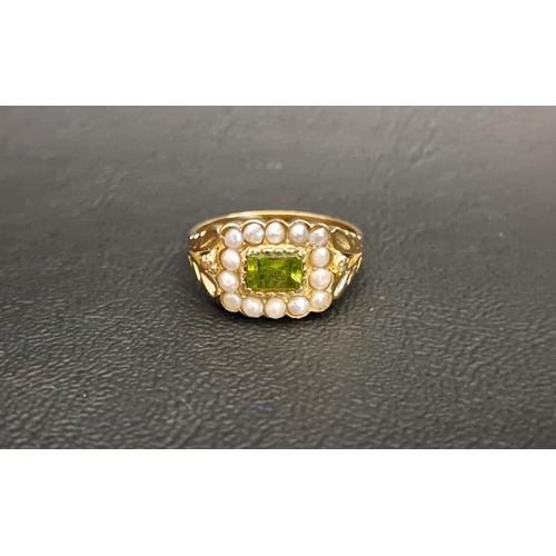 120 - PERIDOT AND PEARL CLUSTER RING 
the central horizontally set rectangular cut peridot in a fourteen p... 