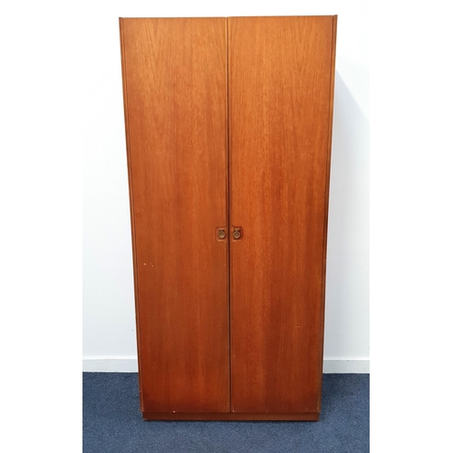 439 - MCINTOSH TEAK WARDROBE
with a pair of doors opening to reveal a shelf and hanging rail, standing on ... 