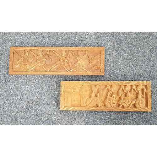 311 - TWO VINTAGE WEST AFRICAN CARVED WOOD PICTURES
both with figure scenes, 14.5cm x 49cm and 14.5cm x 45... 