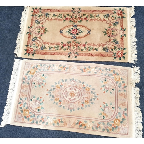 535 - TWO RECTANGULAR CHINESE WASH RUGS
both with floral decoration on cream/oatmeal grounds, both 180cm (... 