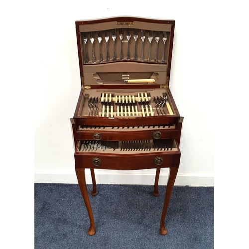 545 - MAHOGANY TABLE CANTEEN OF CUTLERY
the inlaid mahogany canteen with lift up lid and two drawers conta... 