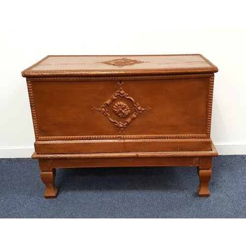 549 - CARVED AND STAINED OAK STORAGE CHEST
with carved floral detail and raised on shaped legs, 85.5cm x 1... 