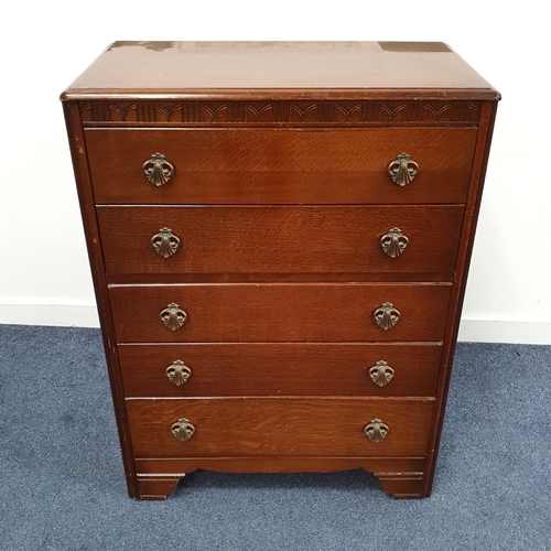 550 - OAK CHEST OF DRAWERS
the motif carved frieze above five drawers, 102.5cm x 77cm x 41cm