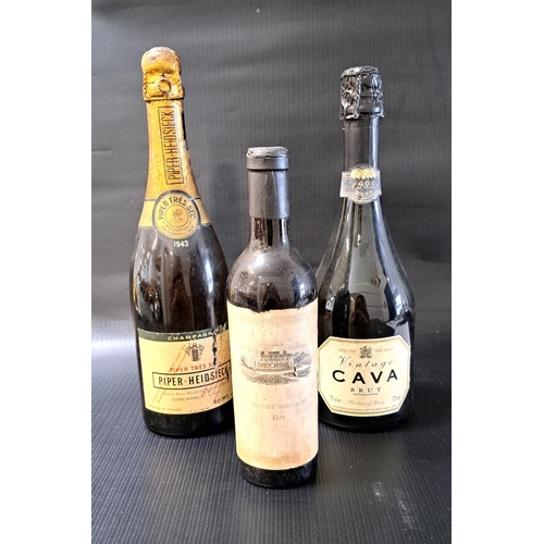 382 - THREE BOTTLES OF VINTAGE WINE/CHAMPAGNE
comprising a 1943 bottle of Piper-Heidsieck Champagne, no vo... 