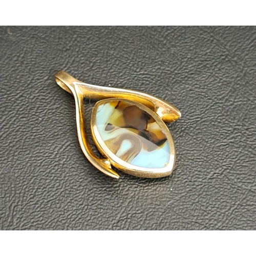 45 - UNUSUAL HARDSTONE SET SWIVEL FOB
in nine carat gold mount, total weight approximately 9.5 grams