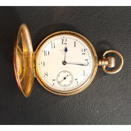 66 - NINE CARAT GOLD CASED FULL HUNTER POCKET WATCH
by Waltham USA, the dial with Arabic numerals and sub... 