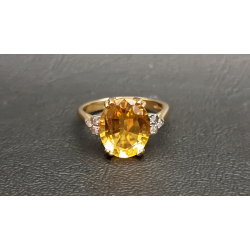 71 - CITRINE AND DIAMOND DRESS RING
the central oval cut citrine measuring approximately 11.8mm x 9.7mm x... 