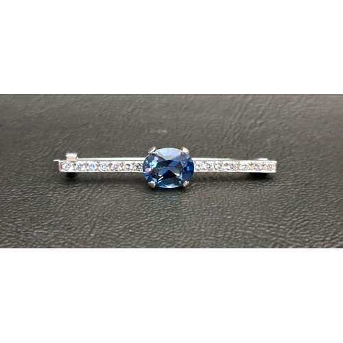 82 - ATTRACTIVE BLUE TOPAZ AND DIAMOND BAR BROOCH
the central oval cut blue topaz approximately 1.5cts, f... 