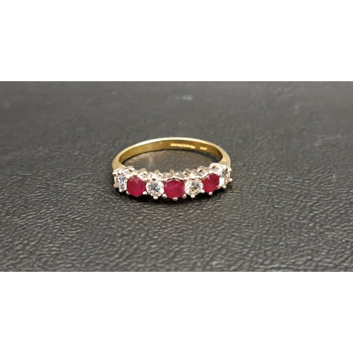 84 - RUBY AND DIAMOND SEVEN STONE RING
the four diamonds totalling approximately 0.35cts and the three ru... 