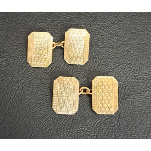 87 - PAIR OF NINE CARAT GOLD CUFFLINKS
with engine turned decoration, total weight approximately 5.3 gram... 