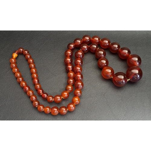 96 - GRADUATED AMBER COLOURED BEAD NECKLACE
the largest bead approximately 24mm diameter, 78cm long and a... 