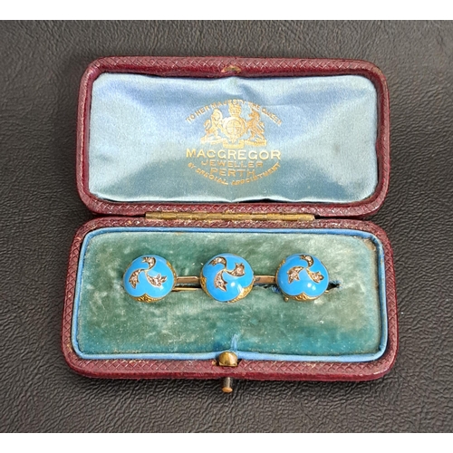 122 - UNUSUAL DIAMOMD AND ENAMEL BAR BROOCH
the bar set with three blue enamel domes, each set with three ... 