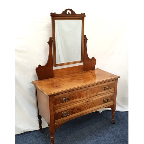 539 - EDWARDIAN MAHOGANY DRESSING TABLE
the shaped back with central mirror above two long drawers with sh... 