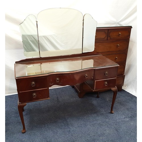 540 - MAHOGANY DRESSING TABLE
with tri-fold shaped mirror, the central drawer flanked by two further drawe... 