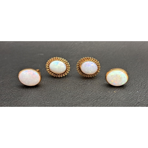 18 - TWO PAIRS OF OVAL OPAL STUD EARRINGS
one pair in eighteen carat gold, the opals measuring approximat... 