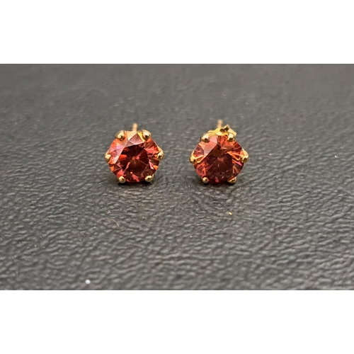 42 - PAIR OF RED/PINK GEMSET STUD EARRINGS
the round brilliant cut gemstones possibly diamonds, each appr... 