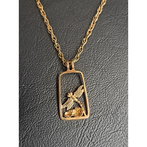 92 - NORMAN GRANT NINE CARAT GOLD DRAGONFLY PENDANT
on silver gilt chain