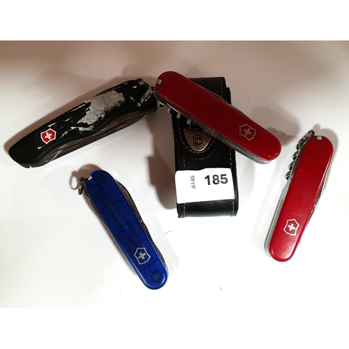 185 - FOUR VICTORINOX SWISS ARMY KNIVES
of various sizes and designs, one in case
Note: You must be over t... 