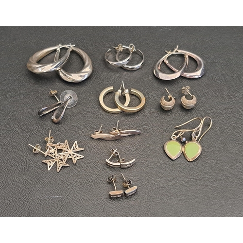 4 - ELEVEN PAIRS OF SILVER EARRINGS
including five pairs of hoop earrings, a pair of enamel drop earring... 