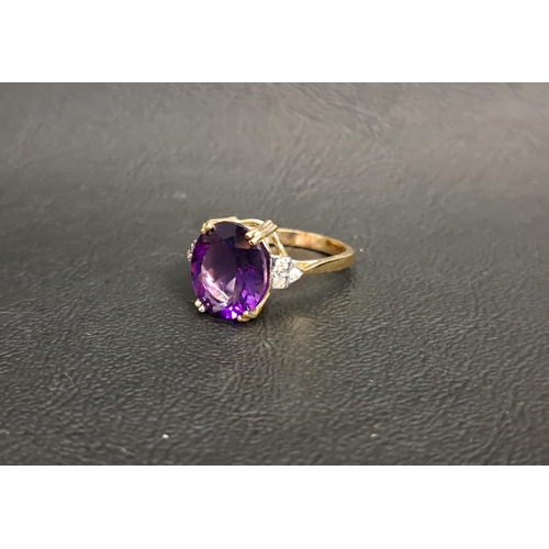 90 - AMETHYST AND DIAMOND DRESS RING
the central oval cut amethyst measuring 11.8mm x 9.6mm x 6.1mm, flan... 