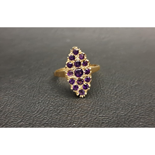 111 - ATTRACTIVE AMETHYST CLUSTER RING 
the multi amethysts set in marquise shaped setting, in all approxi... 