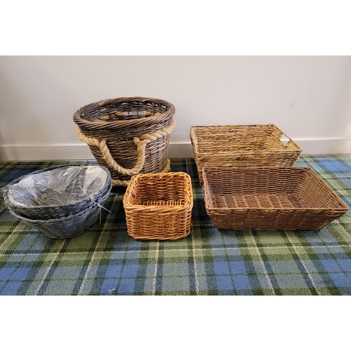 232 - SELECTION OF WICKER BASKETS
comprising a log basket, three storage baskets and two grey plant hangin... 