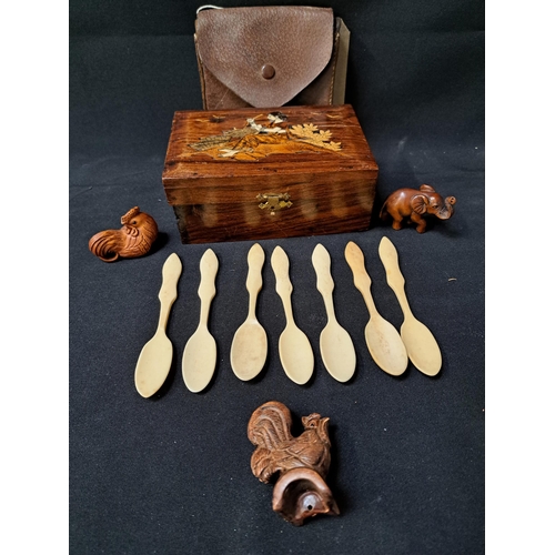 235 - MIXED LOT OF COLLECTABLES
comprising an Indian teak inlaid box, seven shaped bone spoons, carved ele... 