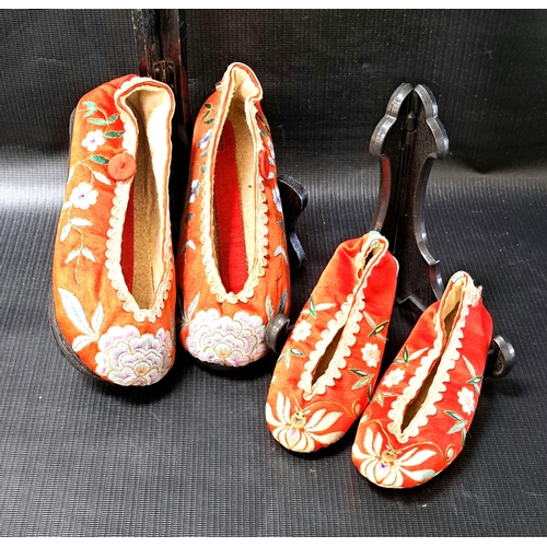 237 - PAIR OF CHINESE RED SILK SLIPPERS
decorated with floral motifs, together with a pair of children's r... 