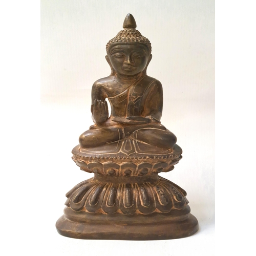 245 - BRONZE FIGURE OF A BURMESE BUDDHA
seated on a double lotus pedestal, his right hand raised, his left... 