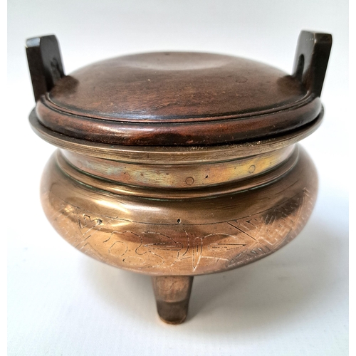 249 - CHINESE BRONZE SHI SHOU CENSER
with a compressed circular body with incised silver inlaid decoration... 