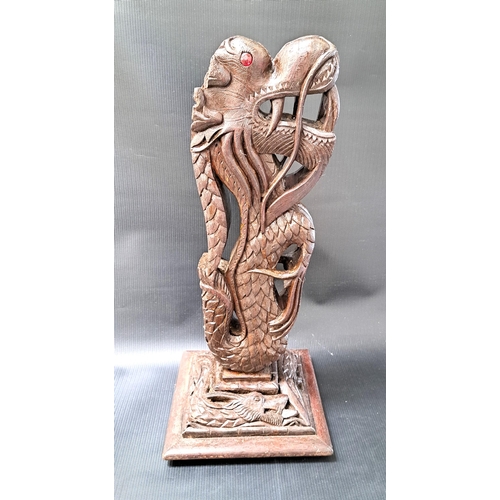 260 - BURMESE CARVED HARDWOOD DRAGON
raised on a square stepped base with a carved dragon, originally a ta... 