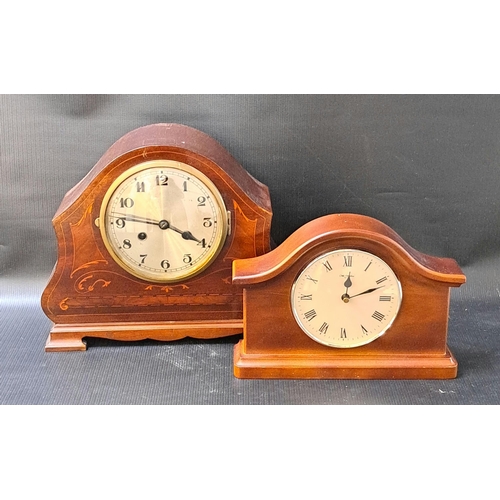 275 - EDWARDIAN MAHOGANY AND INLAID MANTLE CLOCK
with a shaped case and a circular silvered dial with Arab... 