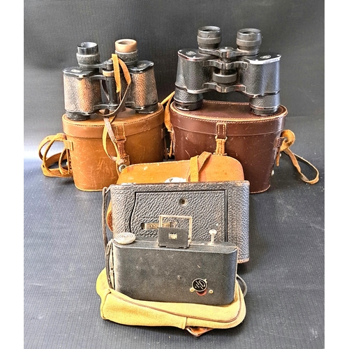 304 - TWO FOLDING CAMERAS AND TWO PAIRS OF BINOCULARS
the cameras comprising a Kodak no.3 Autographic and ... 