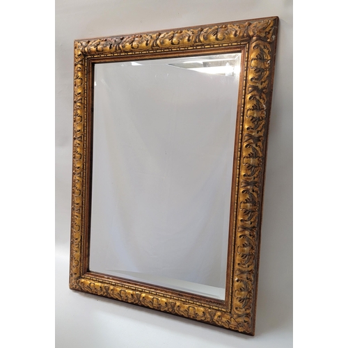 499 - ORNATE GILT FRAME WALL MIRROR
with a bevelled plate, 67cm x 93cm