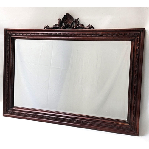 514 - EDWARDIAN STYLE RECTANGULAR TEAK WALL MIRROR
surmounted by a shell, with a bevelled plate, 70cm x 89... 