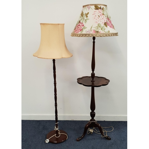 538 - EARLY 20th CENTURY MAHOGANY STANDARD LAMP
the turned column with central shelf and raised on tripod ... 