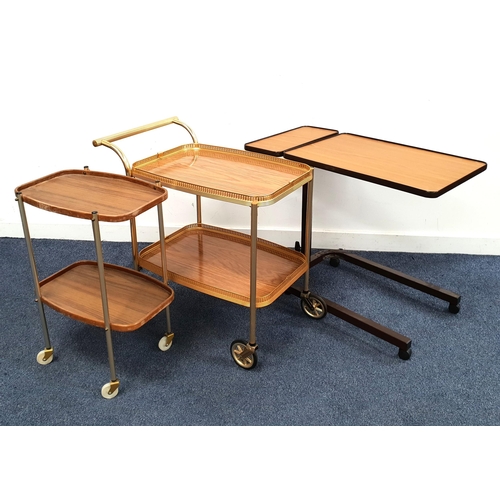 544 - TWO RETRO TEA TROLLIES
together with a height adjustable sofa/bed table on casters (3)