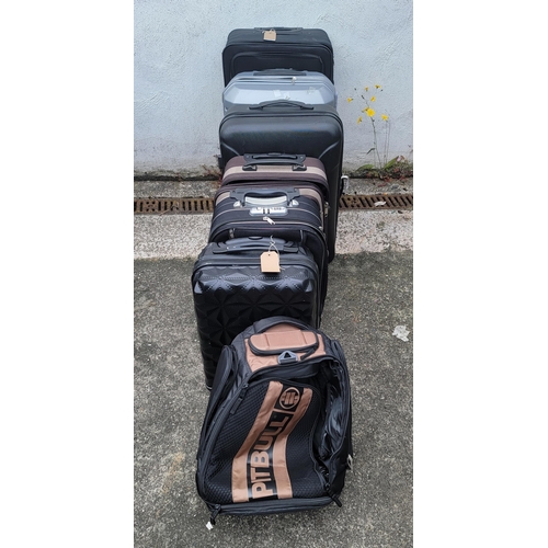 11 - SIX SUITCASES AND ONE RUCKSACK (7)
Including Slazenger, Skyflight and Pitbull
Note all suitcases and... 