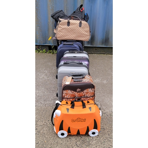 7 - NINE SUITCASES AND FOUR HOLDALLS (13)
Including Trunki, Travelog, Tripp and Go Explore
Note: All sui... 