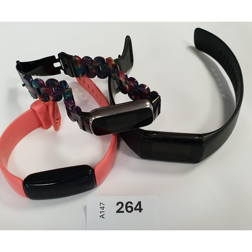 264 - THREE FITBIT FITNESS TRACKERS
comprising a Charge 5, an Inspire 2 and a Luxe, all wiped (3)